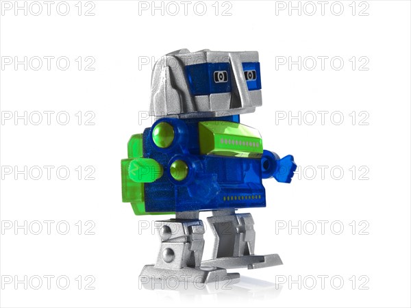 Toy robot on white background. Photo : David Arky