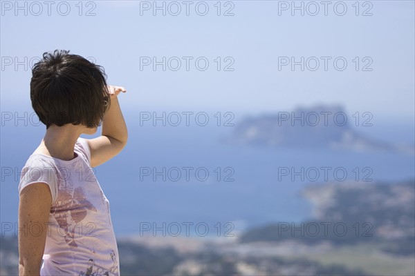 Spain, Costa Blanca, Woman looking at seascape. Photo : Justin Paget