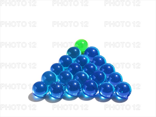 Blue glass balls and green one on the top. Photo : David Arky