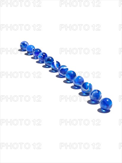 Blue glass balls in a row. Photo : David Arky