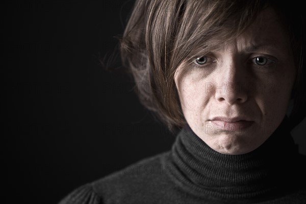 Studio portrait of sad woman. Photo: Justin Paget