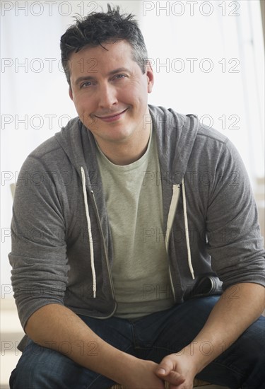 Portrait of mid adult man smiling.