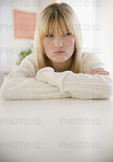 Young woman looking disappointed. Photo : Jamie Grill Photography