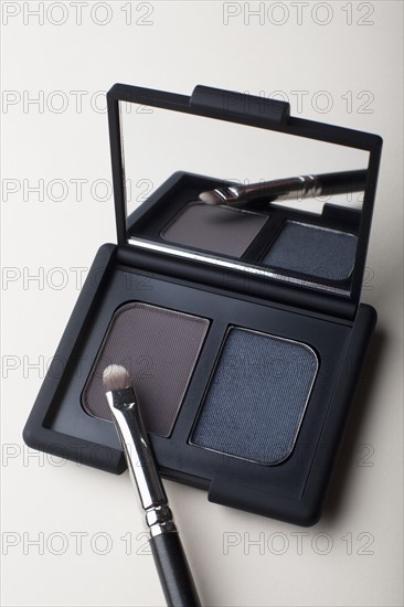 Powder compact with small brush. Photo: Winslow Productions