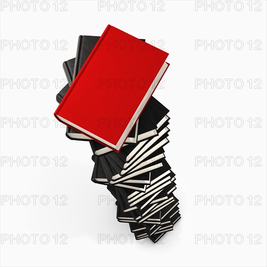 Stack of grey books and one red. Photo : Jon Boyes