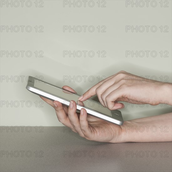 Studio shot of woman with digital tablet.
