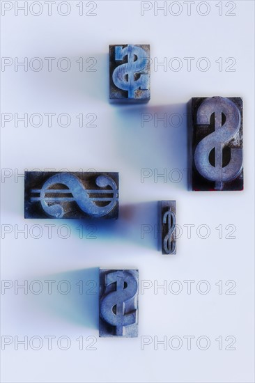 Close up of printing blocks with dollar sign.