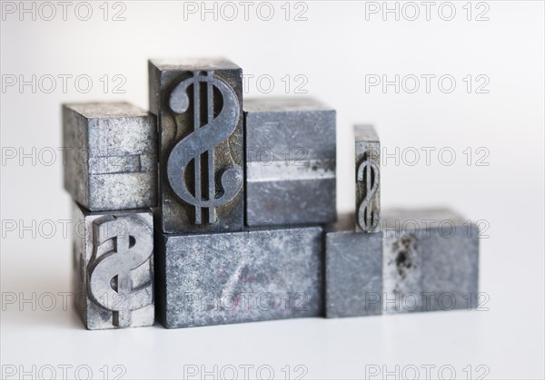 Close up of printing blocks with dollar sign.