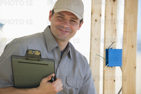 Electrician working at construction site.