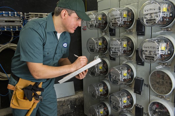 Electrician controlling electric meters.