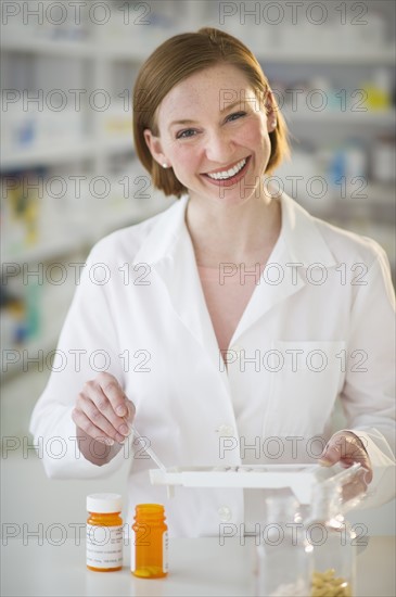 Pharmacist preparing medicine.