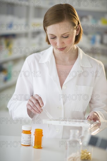 Pharmacist preparing medicine.