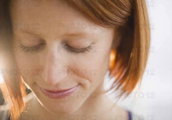 Close-up of redhead woman. Photo : Jamie Grill Photography