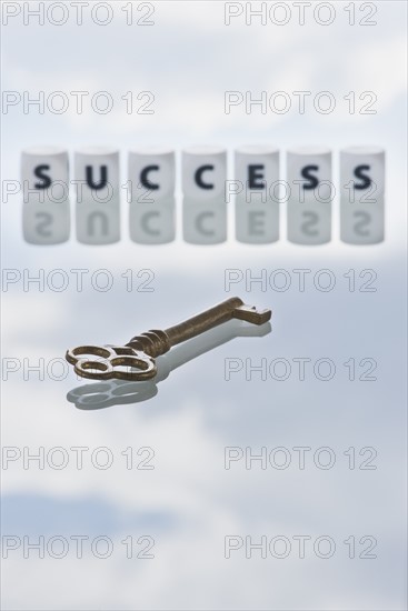 Studio shot of key and dice spelling out success. Photo: Daniel Grill