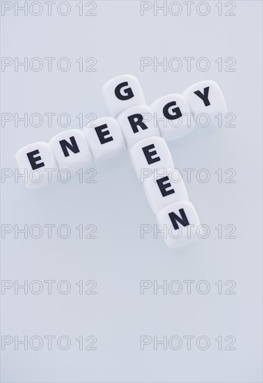 Studio shot of dice spelling out green energy. Photo : Daniel Grill