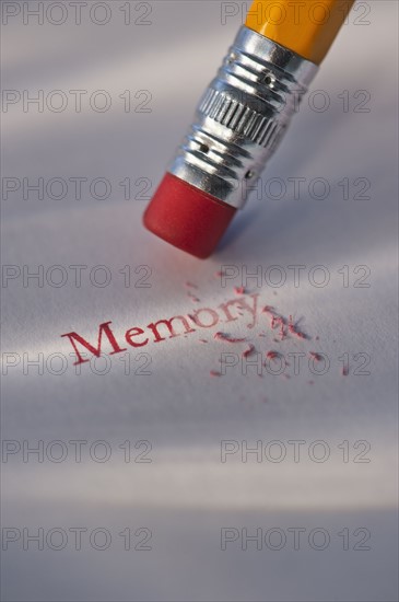 Studio shot of pencil erasing the word memory from piece of paper. Photo : Daniel Grill