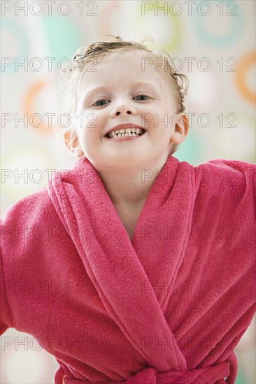 Portrait of girl (2-3) wrapped in bathrobe. Photo : Mike Kemp