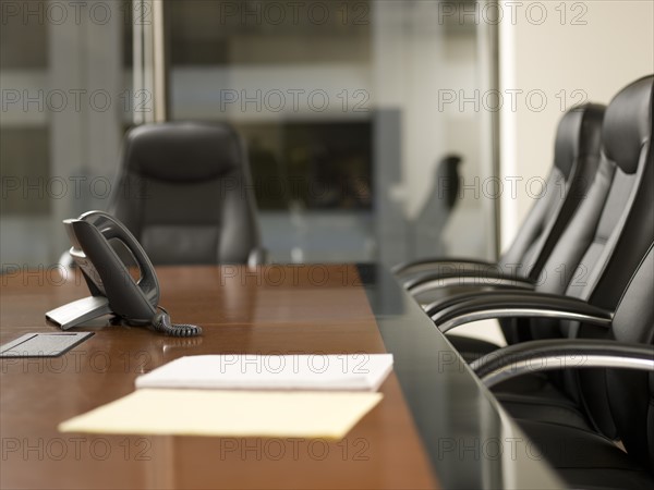 Paper and telephone in board room. Photo : Dan Bannister