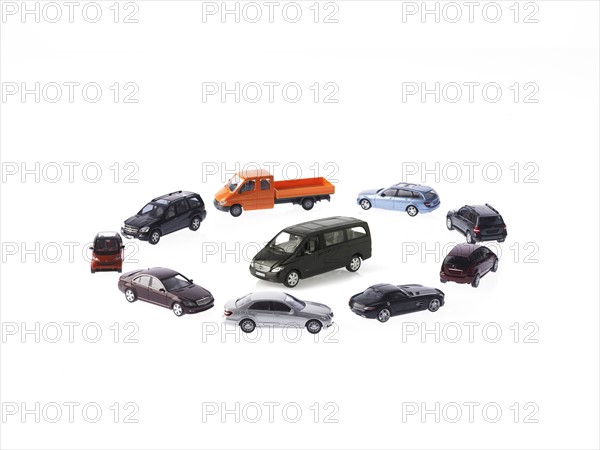 Circle of different cars on white background. Photo : David Arky