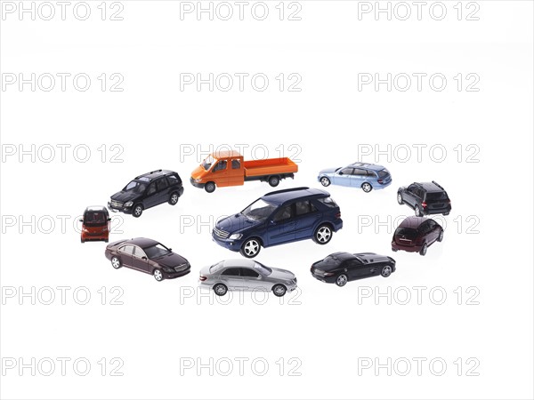 Circle of different cars on white background. Photo: David Arky