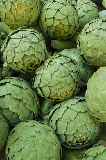 Stack of artichokes on market. Photo: Antonio M. Rosario