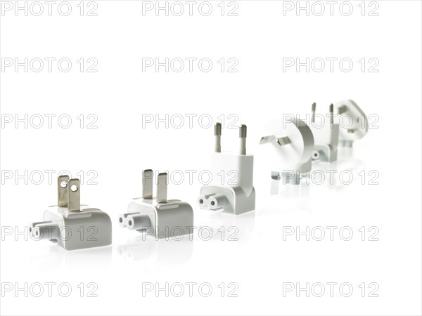 Row of plugs on white background. Photo: David Arky