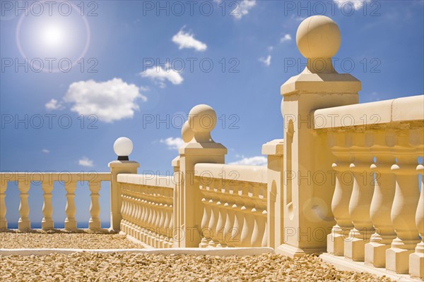 Mediterranean Terrace with Sea, Blue Sky and Cloudscape Backdrop