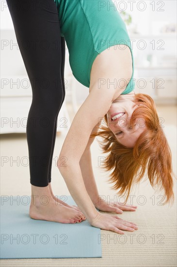 Woman stretching. Photo : Jamie Grill Photography