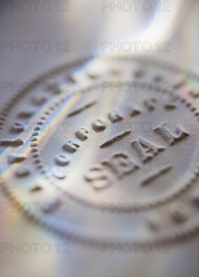 Close up of corporate seal on paper.