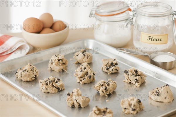 Raw cookies on baking tray.