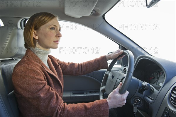 Woman driving car.