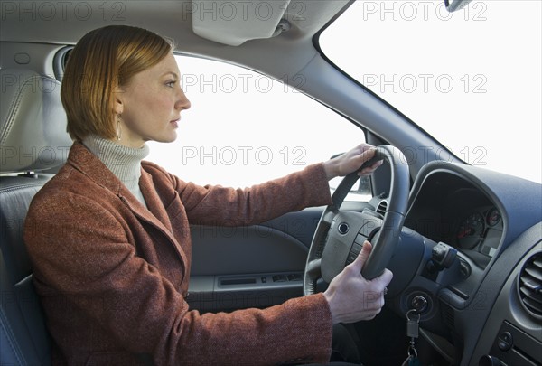 Woman driving car.