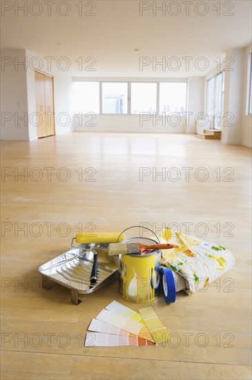 Home improvement equipment in empty apartment.