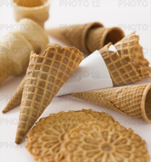 Close up of empty ice cream cones and wafers.
