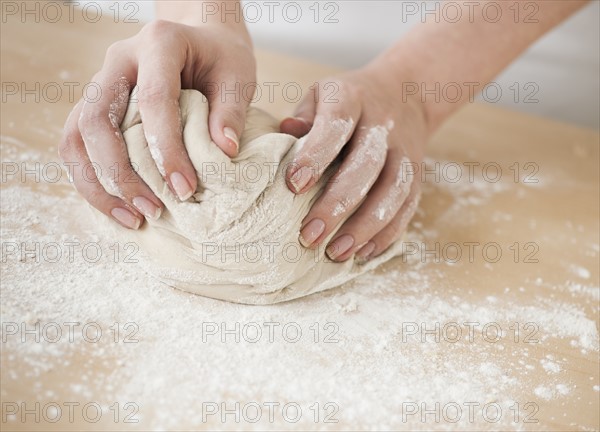 Woman preparing dough.