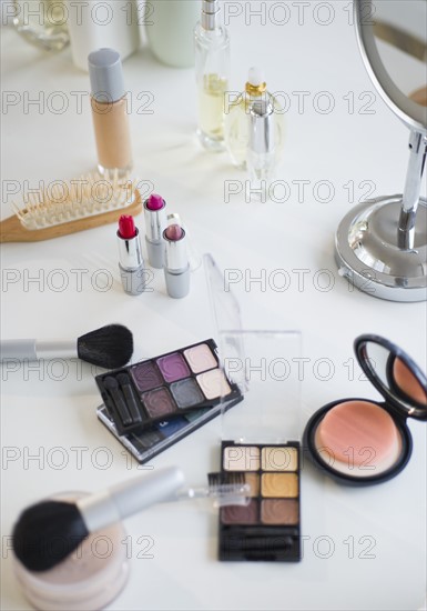 Make-up cosmetics on table.