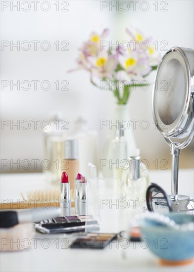 Make-up cosmetics on table.