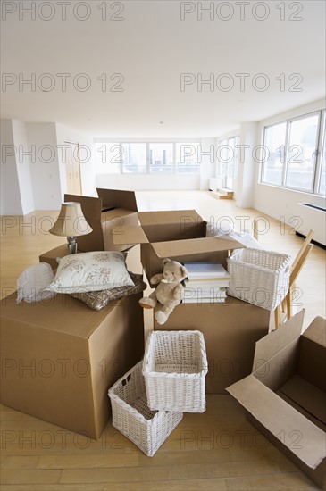 Boxes and decors stacked in room.