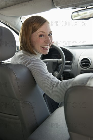 Woman driving car.