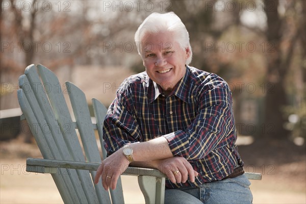 USA, Virginia, Richmond, portrait of senior man in adirondack chair. Photo : Mark Edward Atkinson