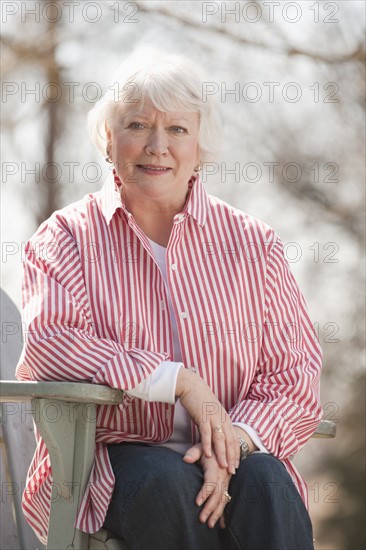 USA, Virginia, Richmond, portrait of senior man in adirondack chair. Photo: Mark Edward Atkinson