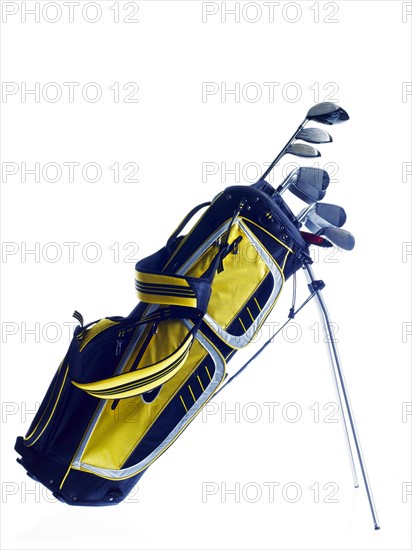 Golf bag with clubs on white background. Photo : David Arky