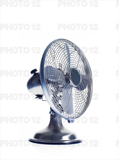 Electric fan on white background. Photo : David Arky