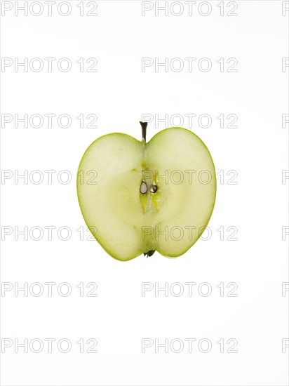 Apple slice on white background. Photo : David Arky
