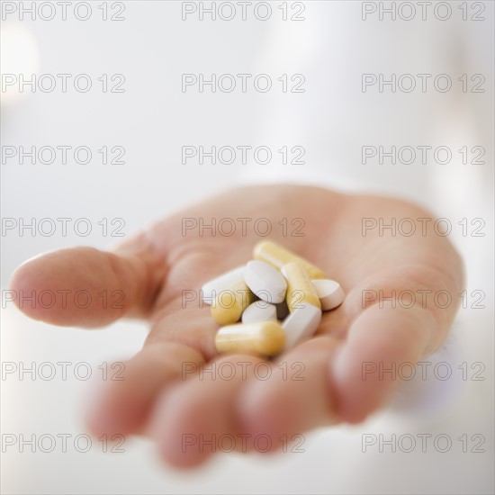 Handful of pills. Photo : Jamie Grill Photography