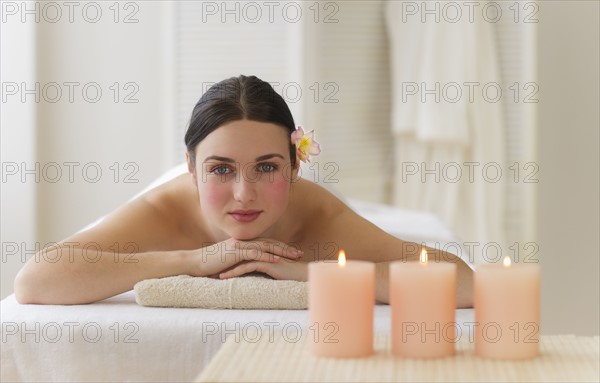 Woman lying on massage table. Photo : Daniel Grill