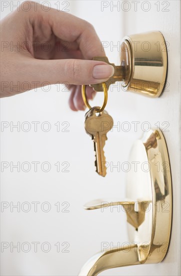 Woman opening door lock.