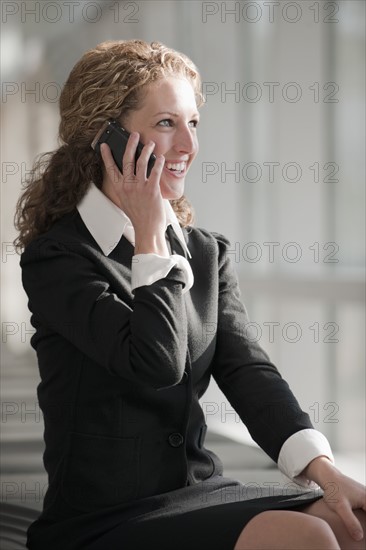 Businesswoman talking on phone. Photo : Mark Edward Atkinson