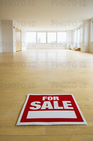 For sale sign in empty room.