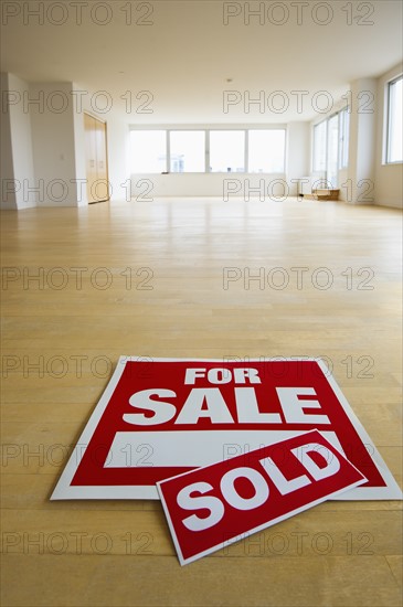 For sale sign in empty room.